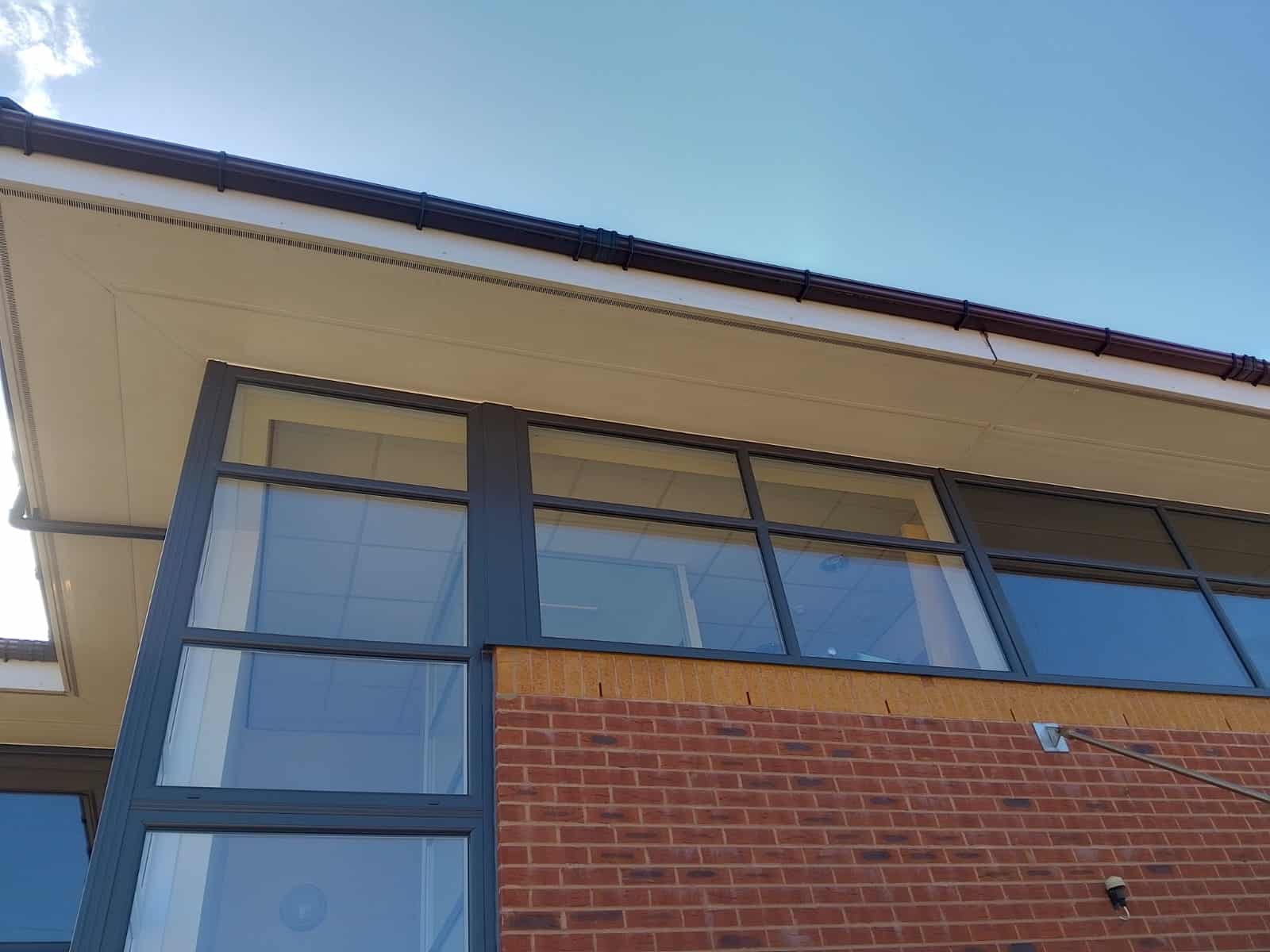 Glass windows below a roof