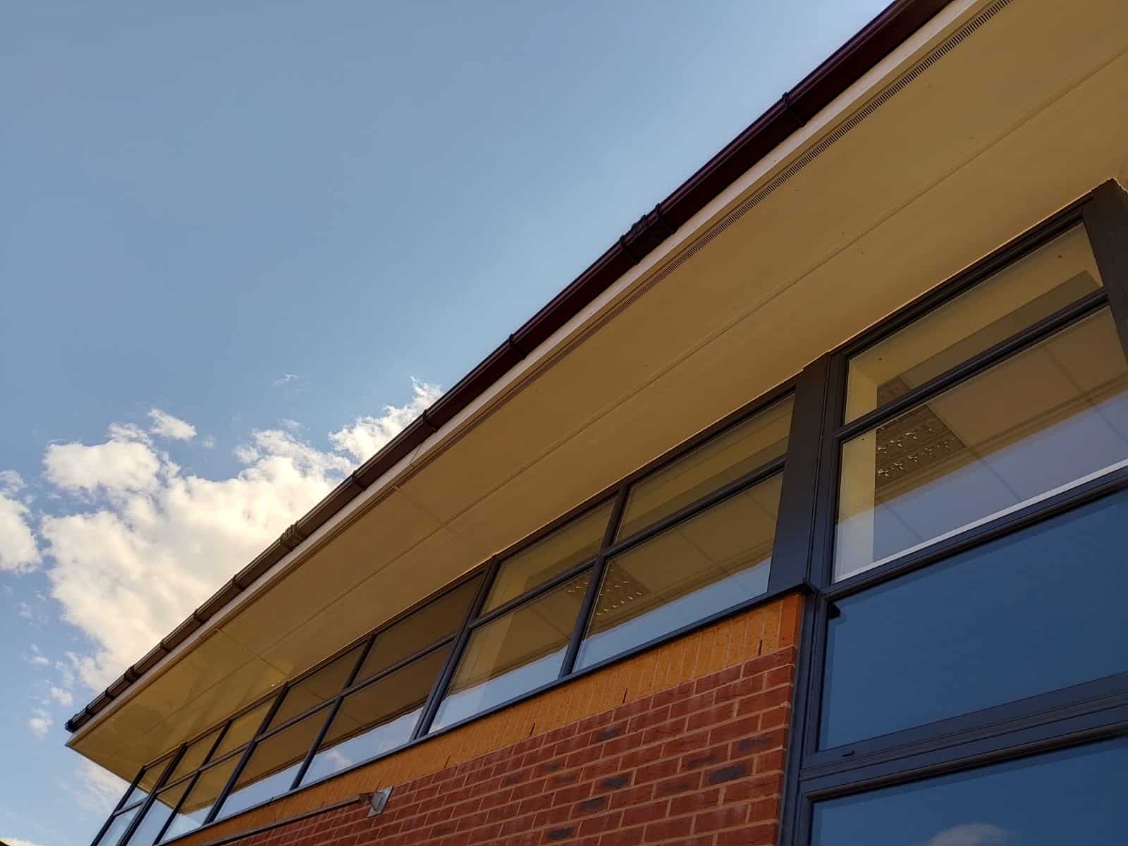 Glass windows below a roof