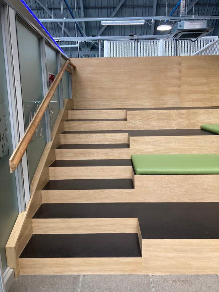 Wooden seating area in a building reception