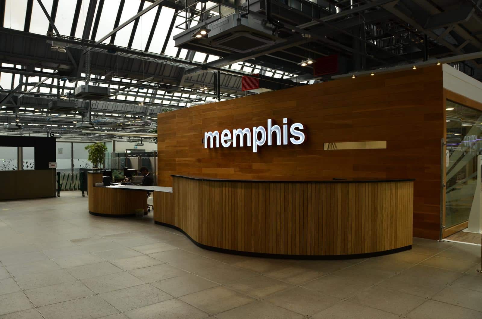 Wooden reception area with illuminated word memphis