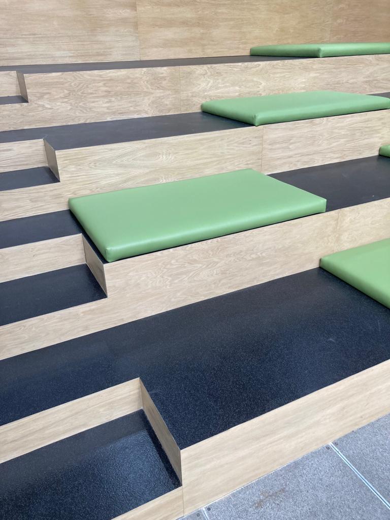 Wooden seating area in a building reception