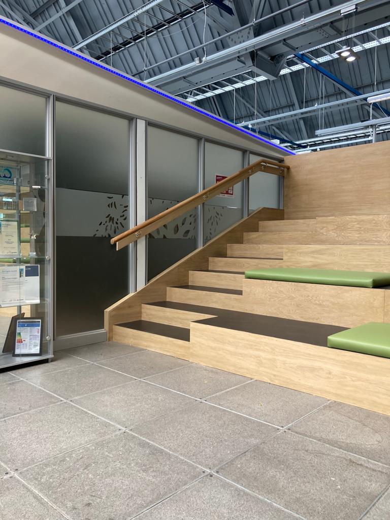 Wooden seating area in a building reception