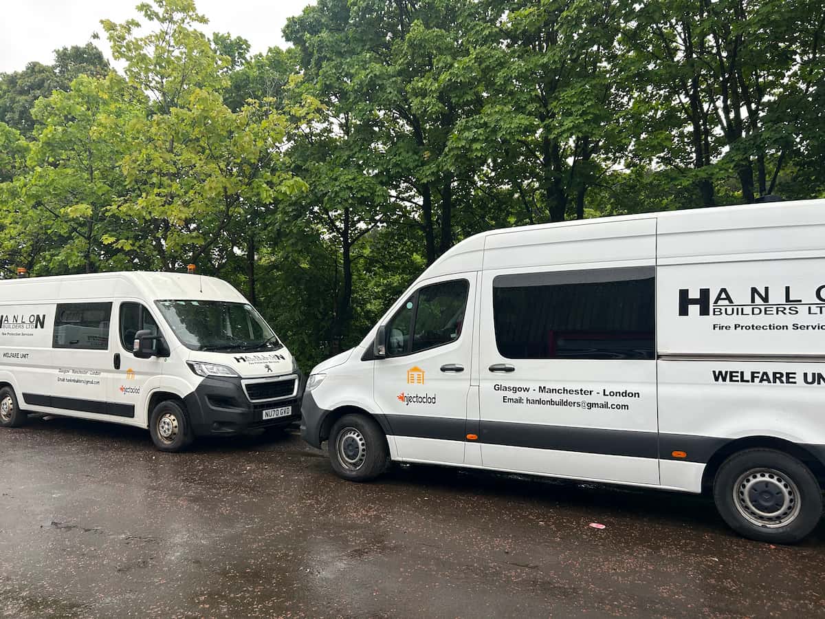 two white vans with Hanlon Builders branding